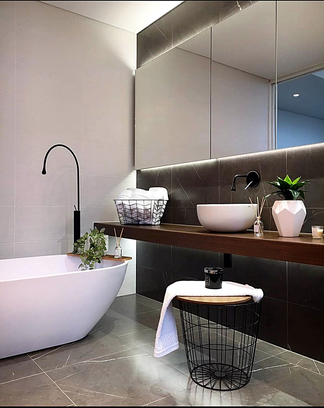 Bathroom renovation with freestanding bath and floating vanity
