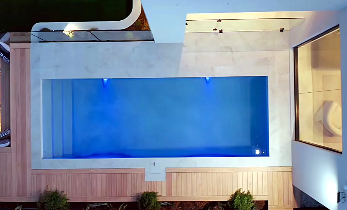 Pool renovation with timber cladding and underwater lighting
